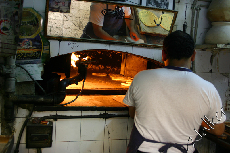 Baker
A baker in a busy Jerusalem street bakes bread the gold old fashion way. And yes, it was very nice.
Keywords: Baker Jerusalem Israel