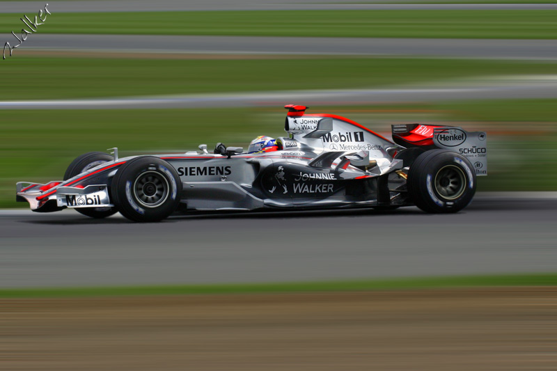 McLaren Zoom
Okay, this is Montoya in his McLaren that has been edited. I cut out the car, blurred the background, pasted the car back on and blurred the wheel hubs.

Thats it!
Keywords: McLaren Montoya