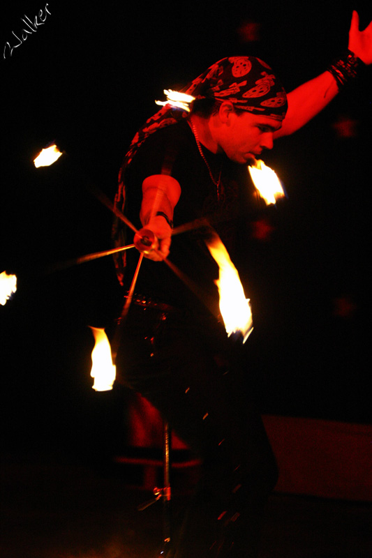 Fire Starter
A Circus Perfomer juggles fire while riding a uni-cycle (and wheel was on fire too)
Keywords: Circus Performer juggle fire