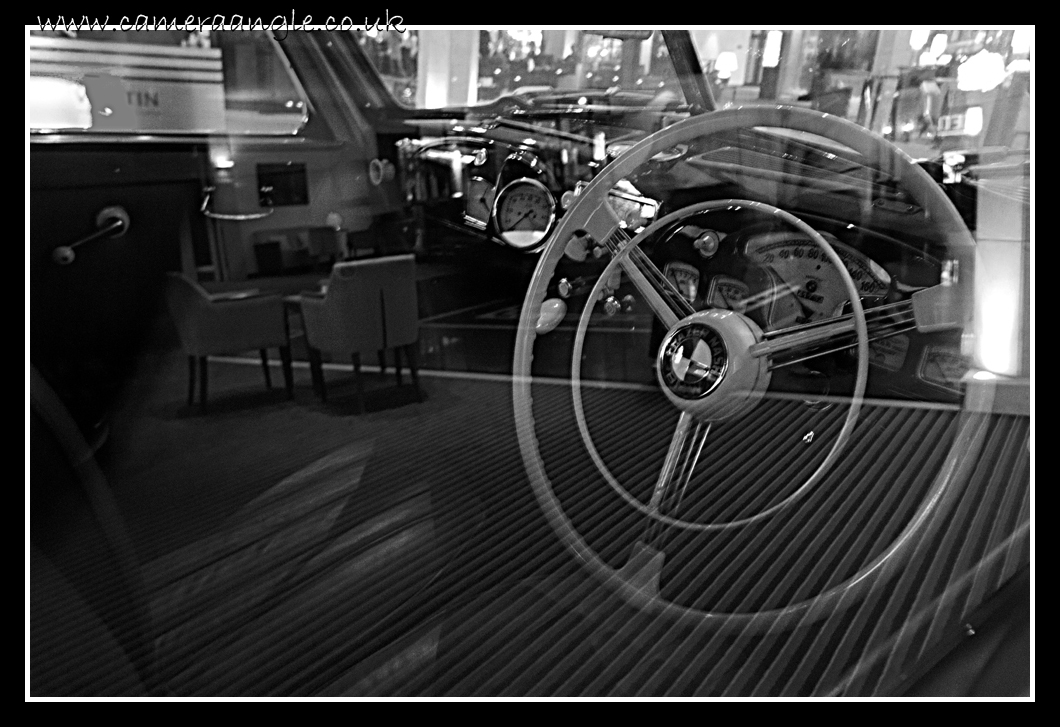 Cafe Auto
A hotel lobby reflects in a car window. Taken in the Westin Hotel, Munich, Germany.

Keywords: Cafe Window Car Westin Munich Germany