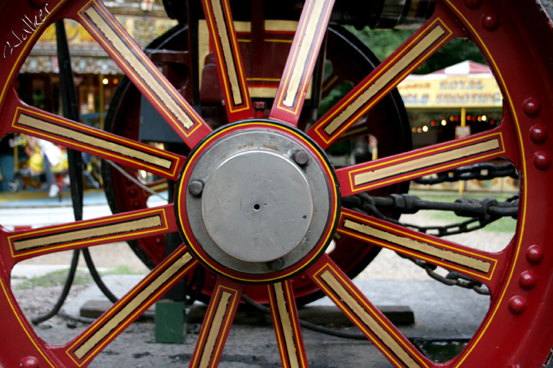 Steam Engine Wheel
A steam fair is visible through a Steam Engine Wheel
Keywords: Steam Engine Wheel