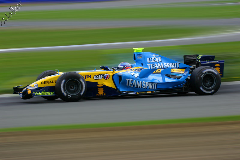 Renault F1 Car
Okay, this is a Renault at Silverstone that has been edited. I cut out the car, blurred the background, pasted the car back on and blurred the wheel hubs.

Thats it! 
Keywords: Renault F1 Silverstone